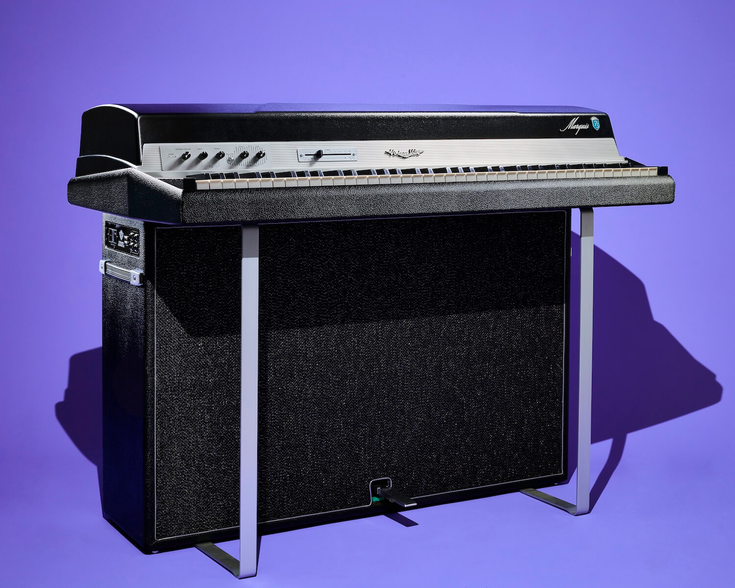 A Vintage Vibe Marquis 73 on its matching stereo console, photographed on periwinkle seamless